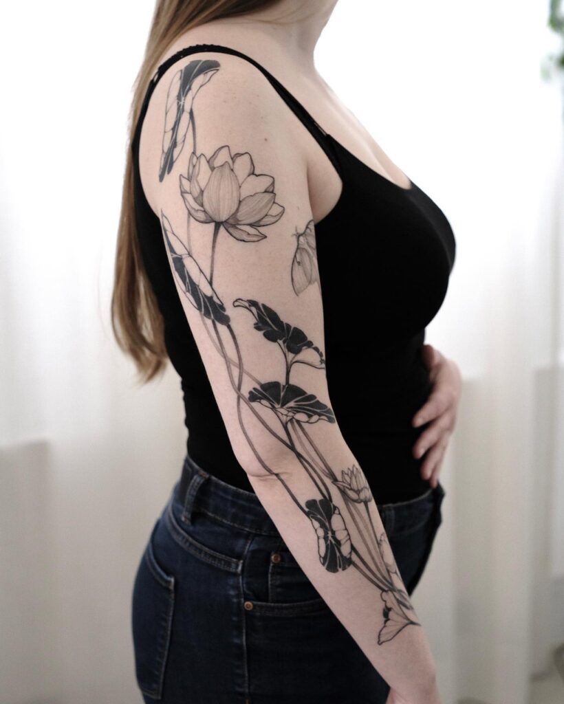 Sleeve of serenity lotus flower full sleeve tattoo