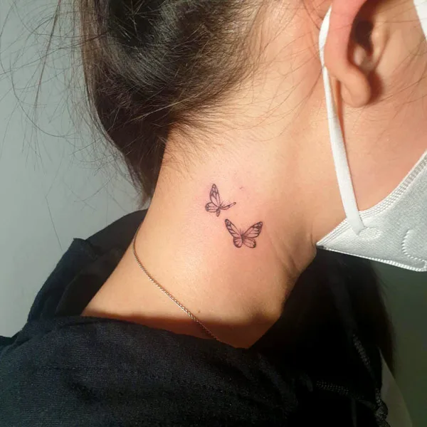 Small Butterfly Neck Tattoo