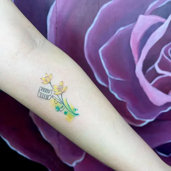 Small December birth flower tattoo