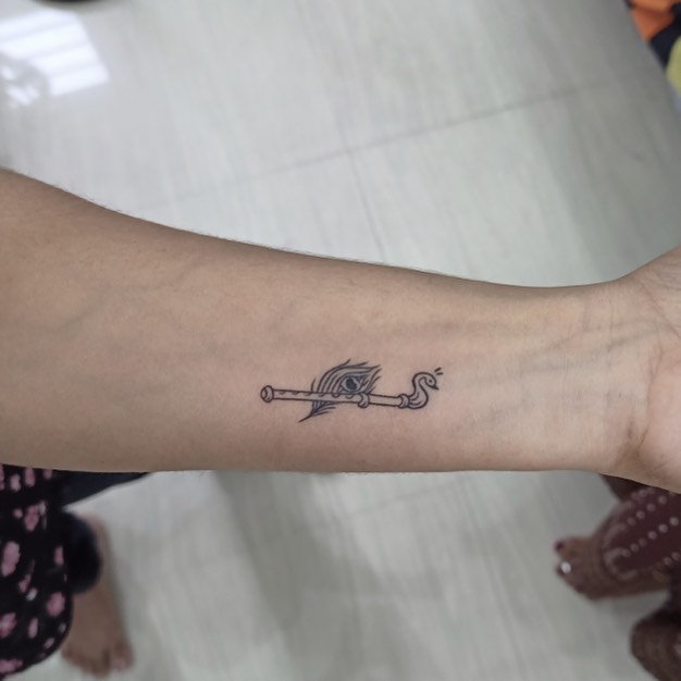 Small Flute with Peacock Feather Tattoo on Hand Musical Inspiration