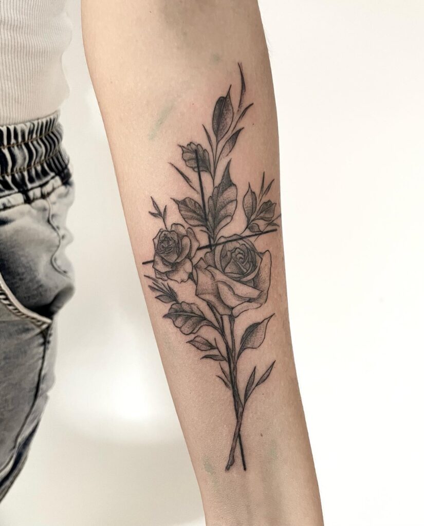 Small Inner Forearm Tattoo Symbolism of Roses and Cross in a Subtle Design