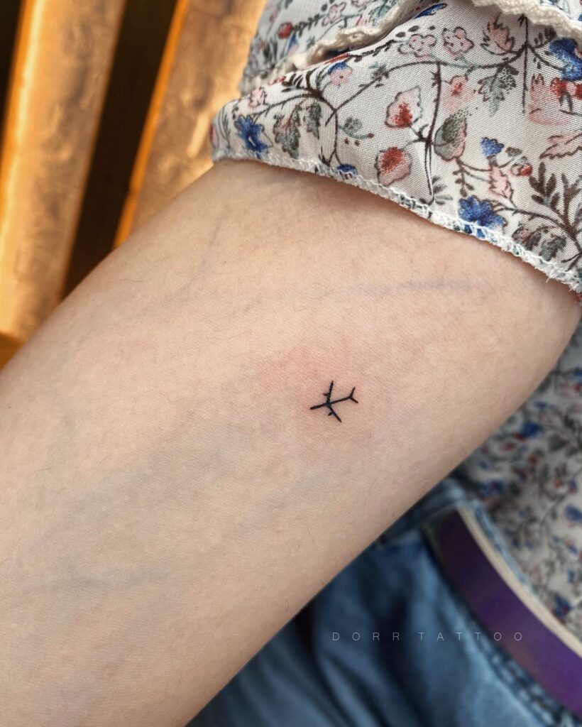 Small Aero Plane Tattoo Soaring on the Side of the Forearm for Her: Skybound Dreams