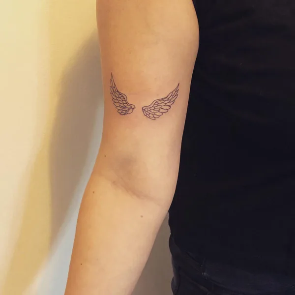 Small angel wings tattoo 3