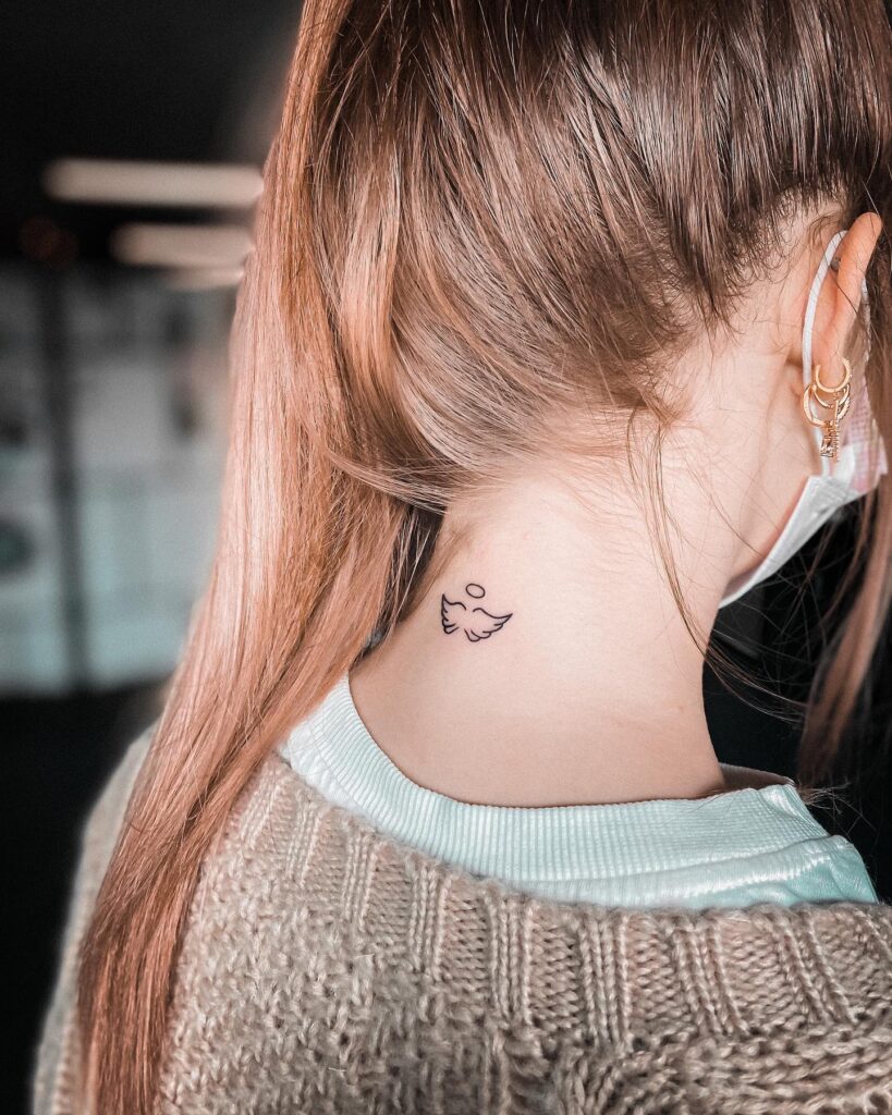 Small Angel Wings Tattoo on the Back of the Neck: Heavenly Nape