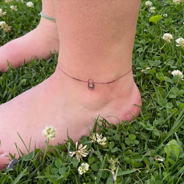 Small ankle bracelet tattoo