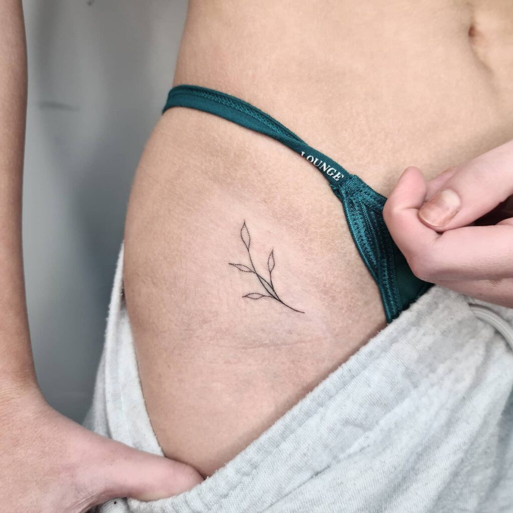Small Botanical Tattoo on the Hip: Botanical Bloom