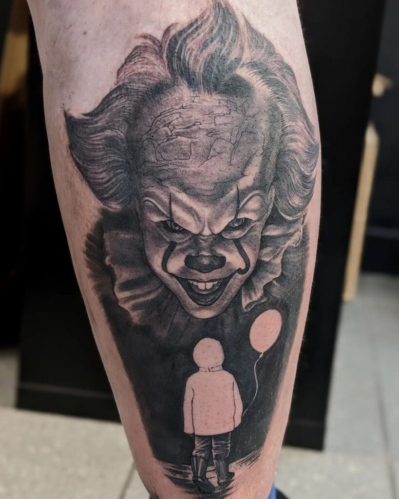 Small Boy Approaching Pennywise in a Horror Movie Fan Tattoo, on the Calf: Pennywise Pursuit