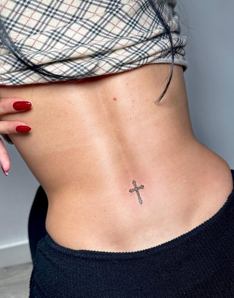 Small Cross Tattoo on the Lower Back: Faithful Mark