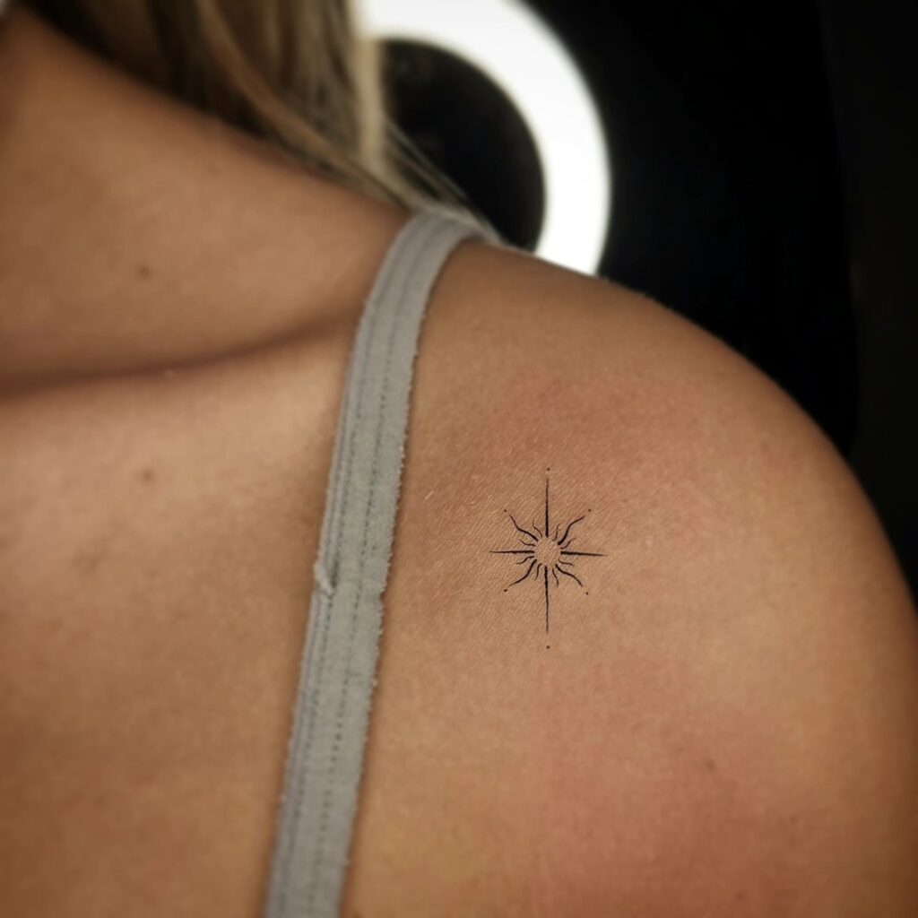 Small delicate star tattoo on shoulder for girls