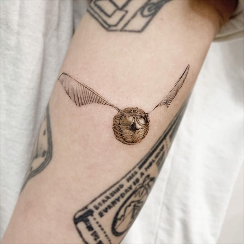 Small Golden Snitch Forearm Tattoos