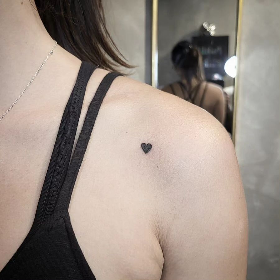 Small Heart Filled with Black Color Tattoo: Shoulder Elegance
