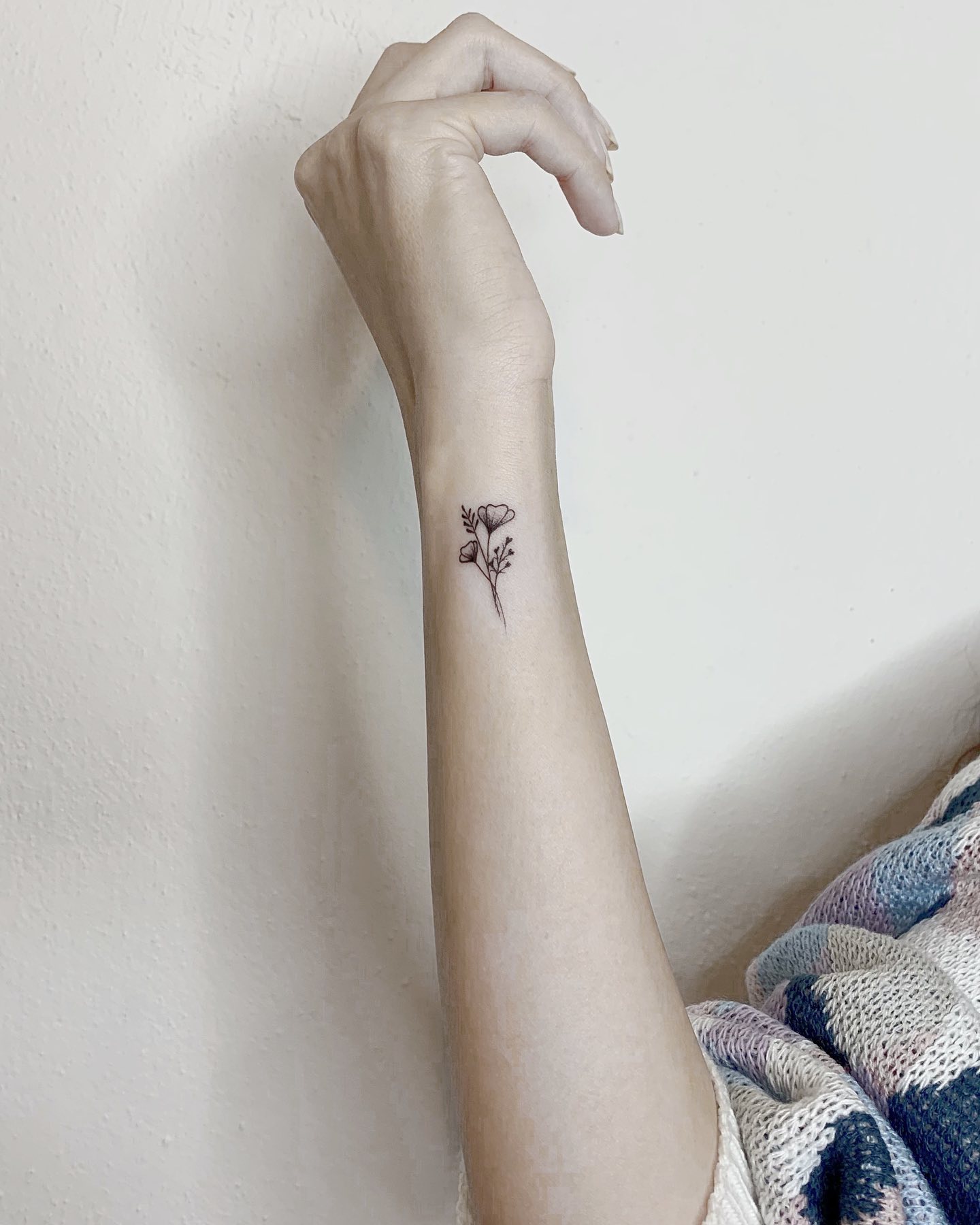Small Heart Shaped Flower Tattoo on Wrist Feminine and Elegant Minimalist Design