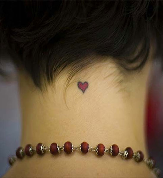 Small heart tattoo on neck