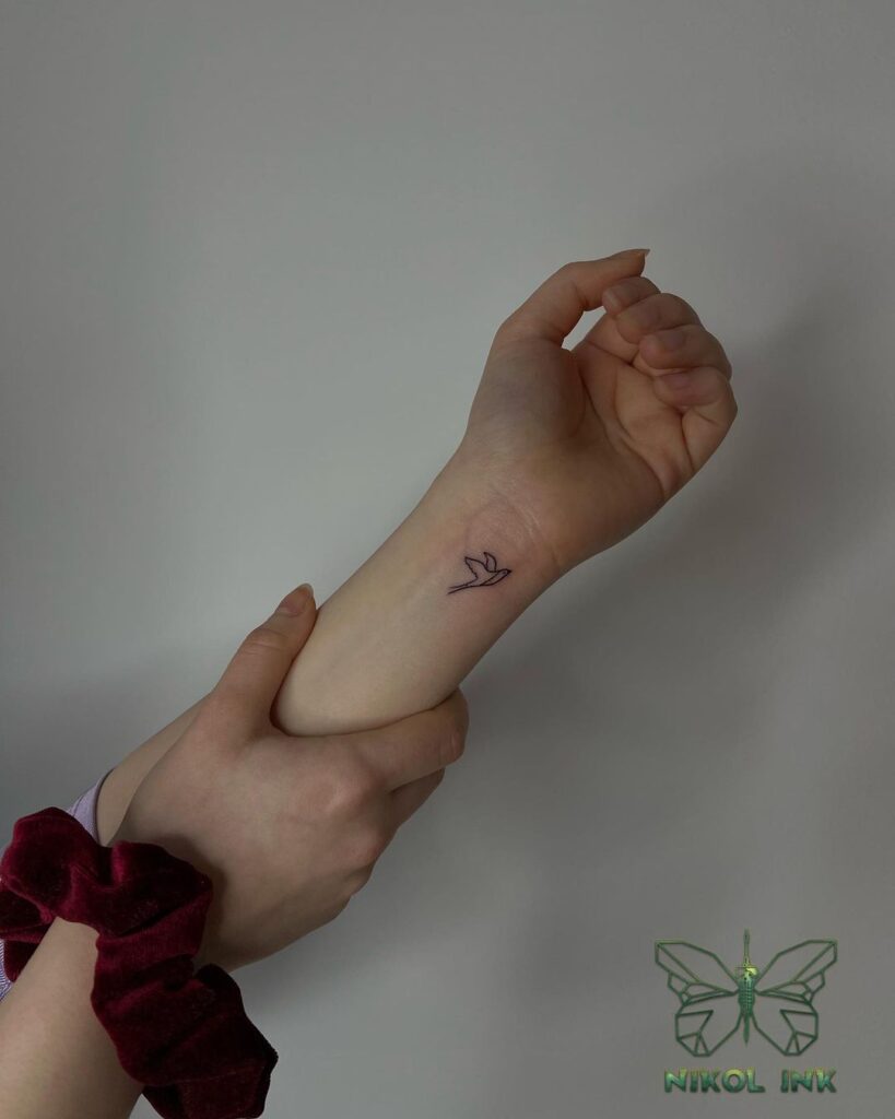 Small outline bird tattoo for girls a graceful avian symbol
