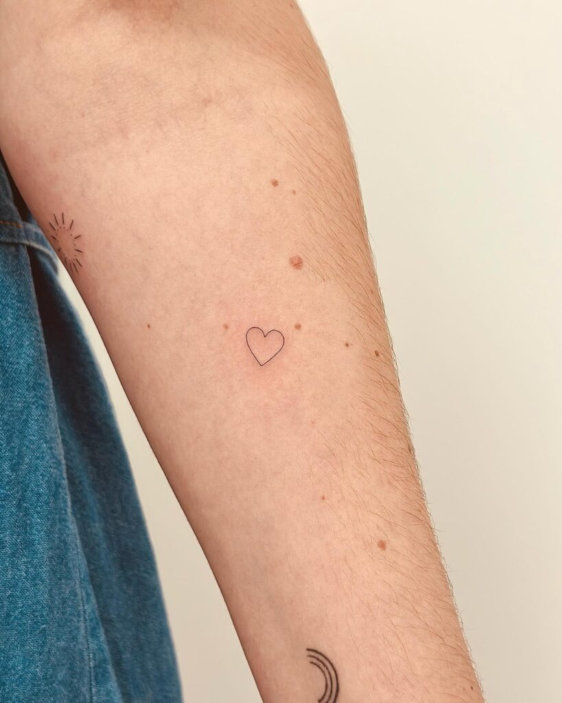 Small Outline Heart Tattoo Making a Statement on the Forearm: Heartfelt Minimalism
