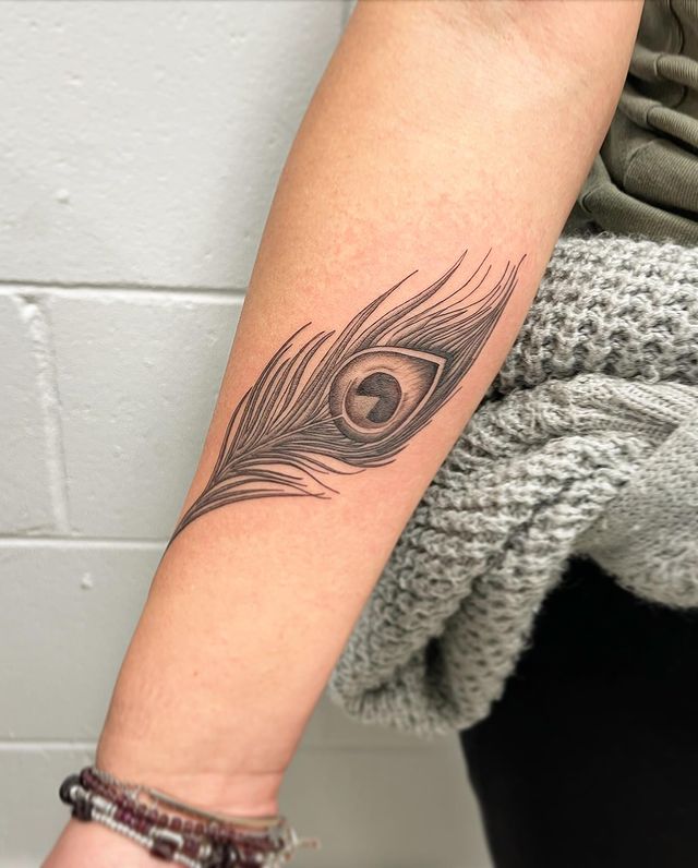 Small peacock feather tattoo design on hand Small peacock feather tattoo design on hand
