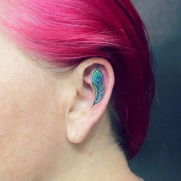 Small peacock feather tattoo