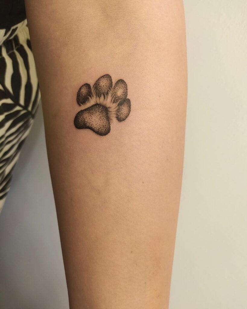 Small Realistic Black and Grey Shaded Paw Print Tattoo: Below the Elbow Beauty