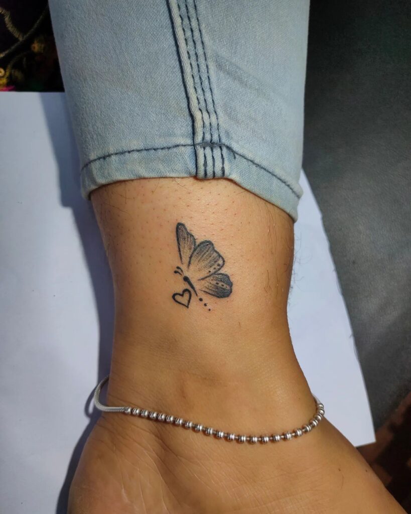 Small Side-Flying Butterfly with Outline Heart on the Leg: Fluttering Elegance