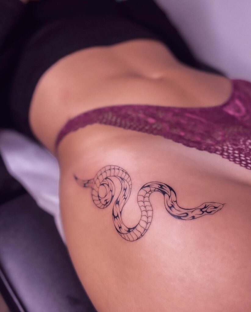 Small Snake Hip Tattoo, a Subtle and Slithering Accent to the Hip Curve: Sleek Serpent