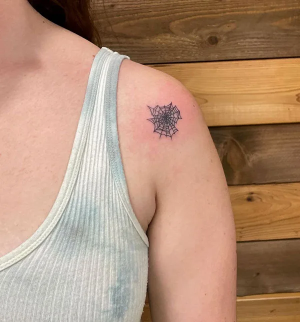 Small spider web tattoo