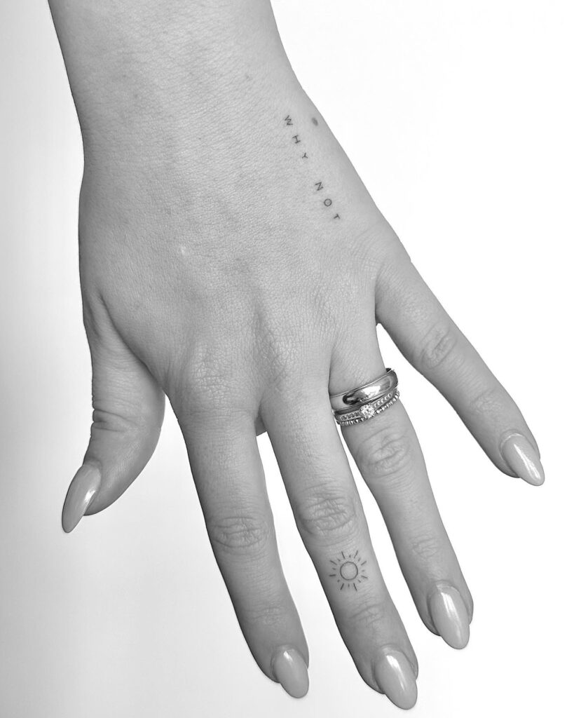 Small sun outer middle finger tattoo miniature sunshine charm