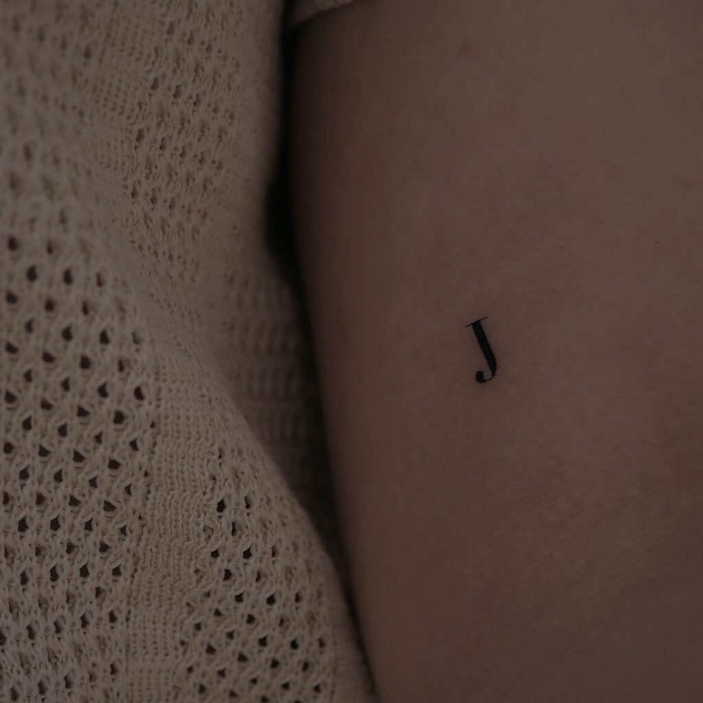 Small Tiny 'J' Letter on the Inner Arm Tattoo: Understated Sophistication, a Subtle Mark