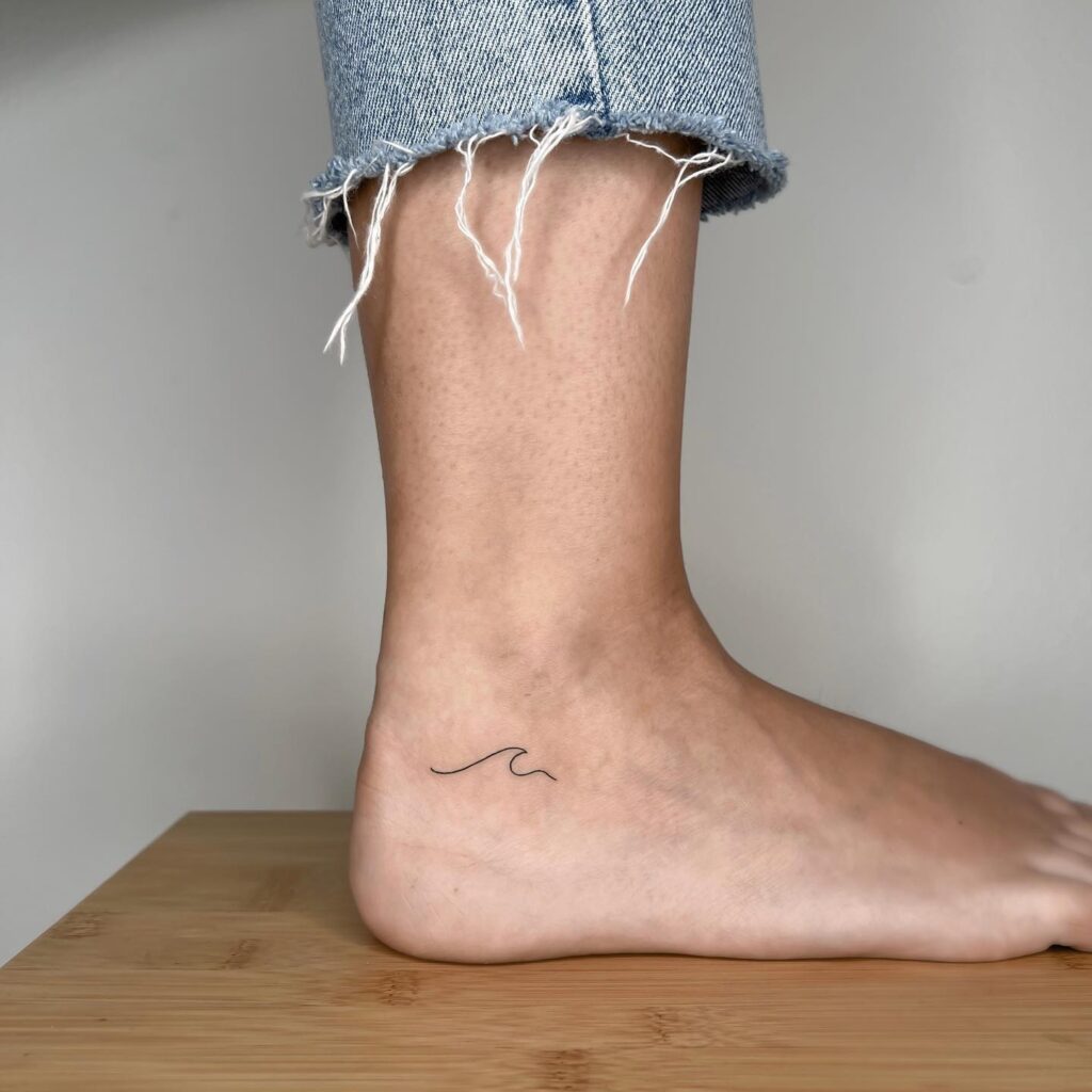 Small Wave Below the Ankle Tattoo: Ankle Wave Serenity