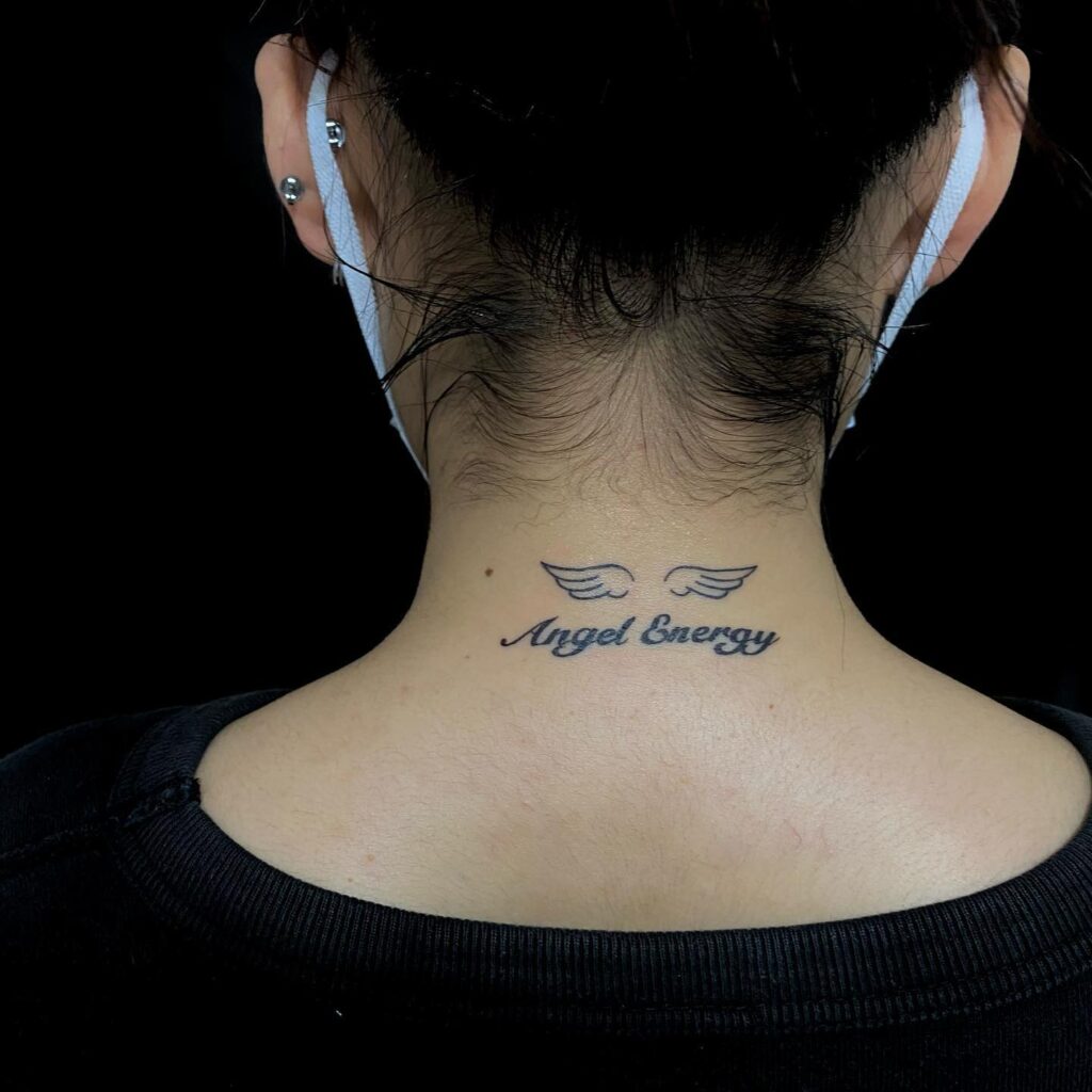 Small Wings Tattoo with 'Angel Energy' Lettering on the Back of the Neck: Angelic Aura