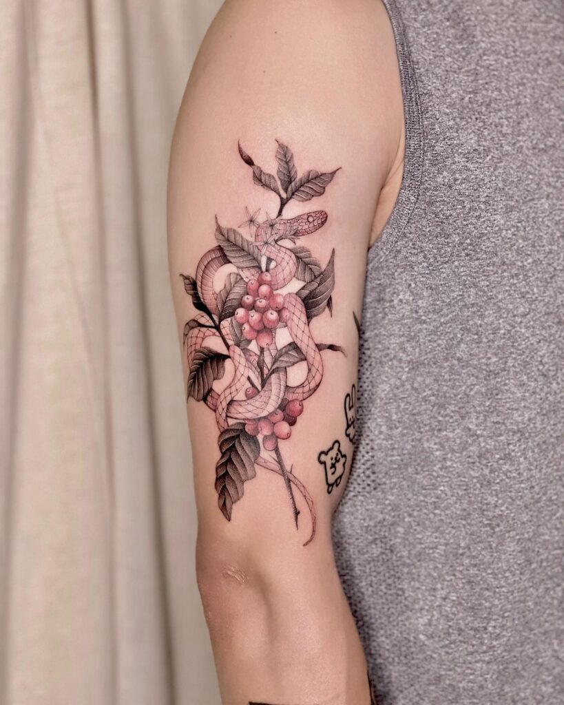 Snake and coffee plant tattoo on arm for men symbolic fusion