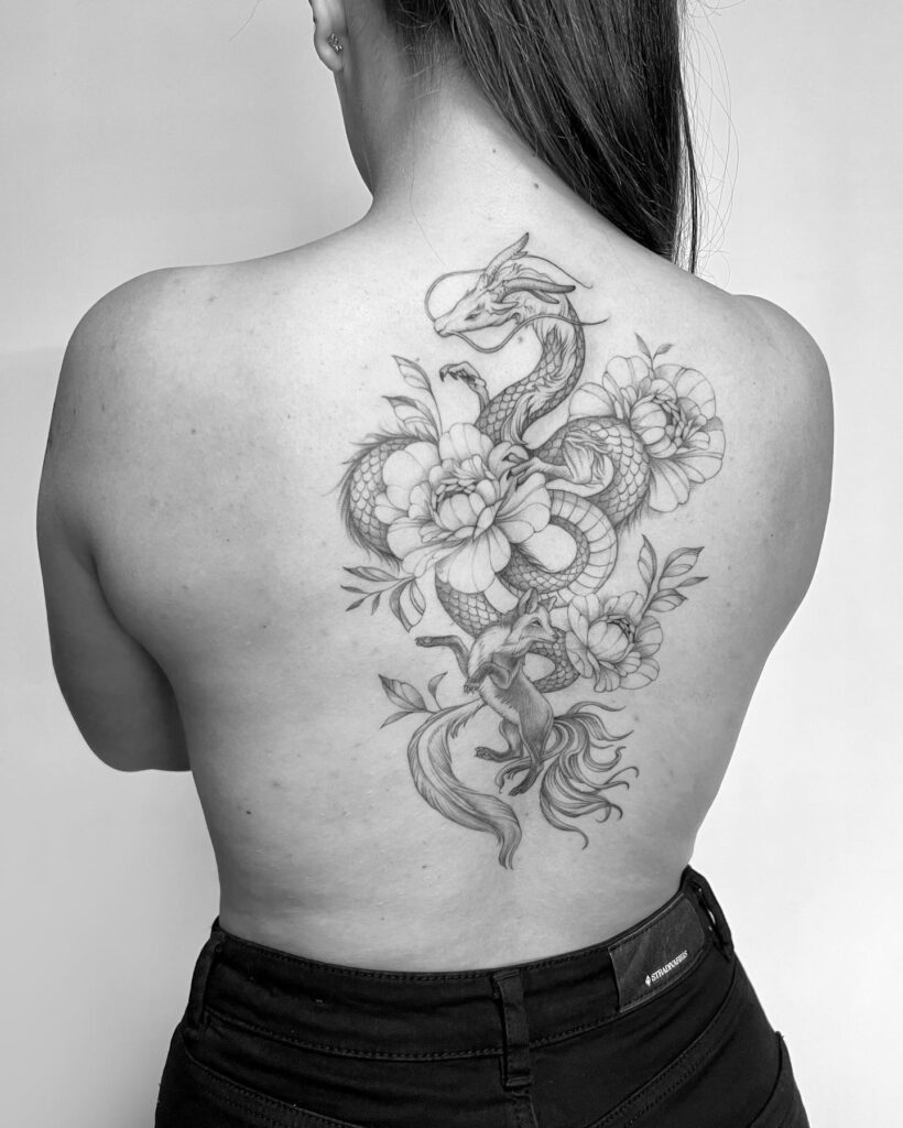 Snake, Flowers, and Fox Tattoo on the Back for Females: Nature's Tapestry