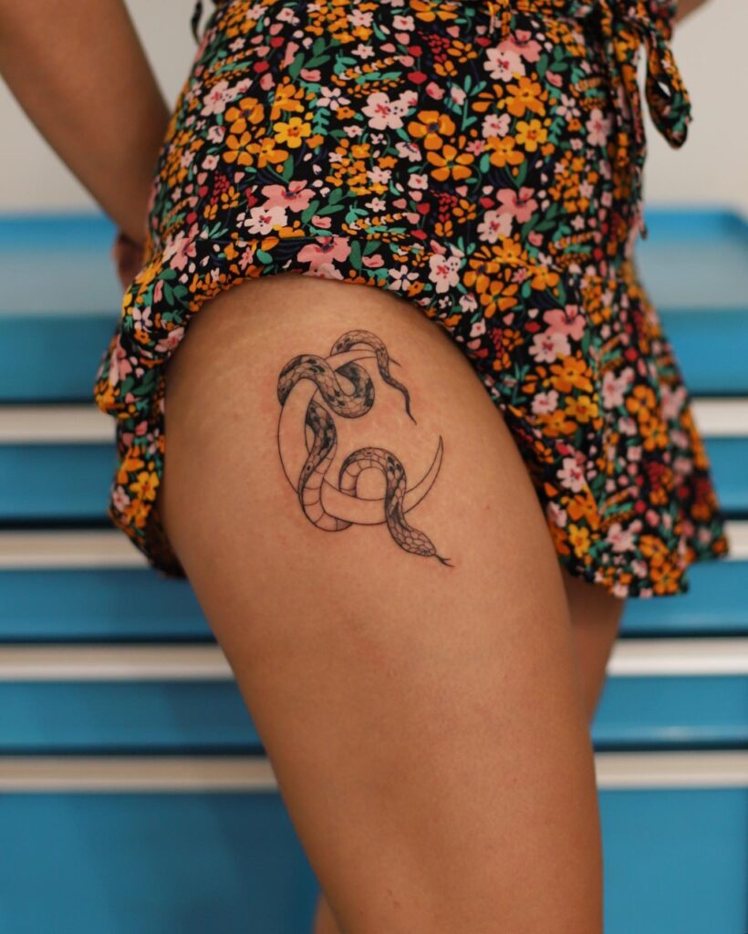 Snake Wrapped Around Moon Tattoo on the Side Hip: Celestial Embrace, a Cosmic Dance