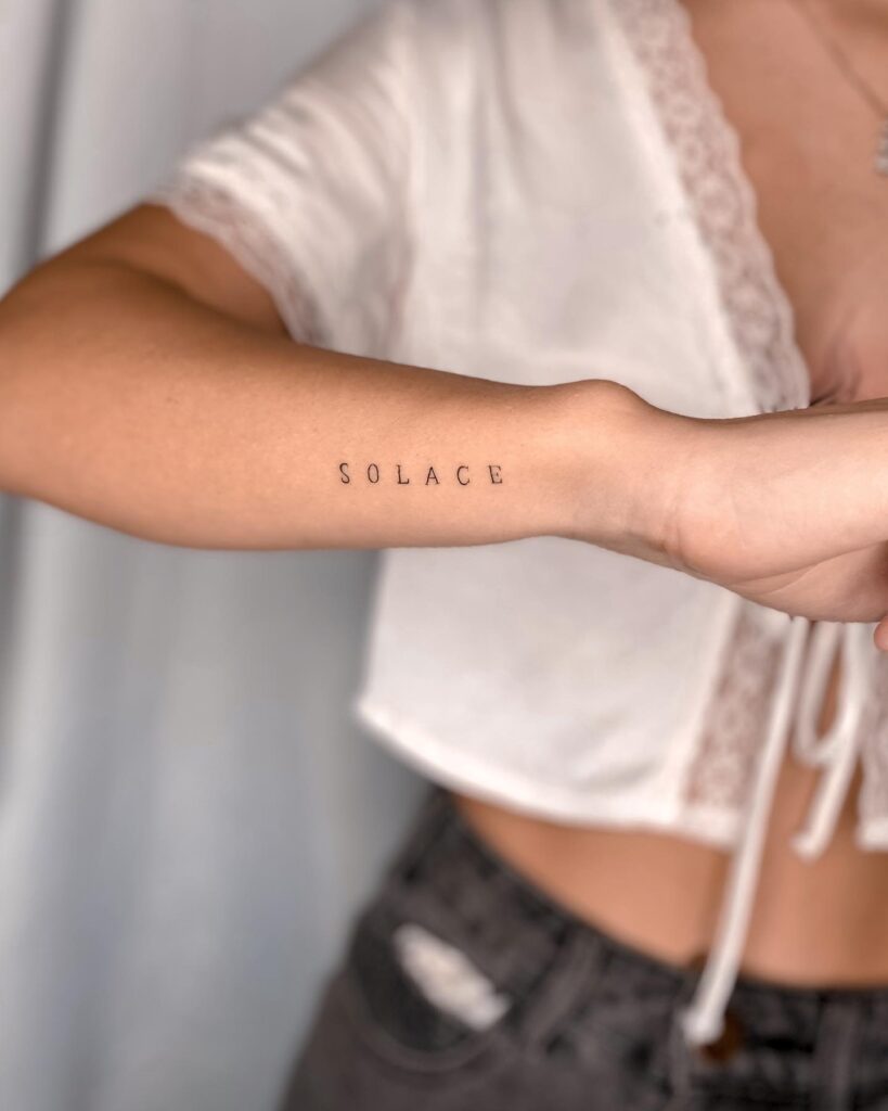 SOLACE Lettering Tattoo on the Side Forearm, Spaced Letters for a Clean Aesthetic: Soothing Solace