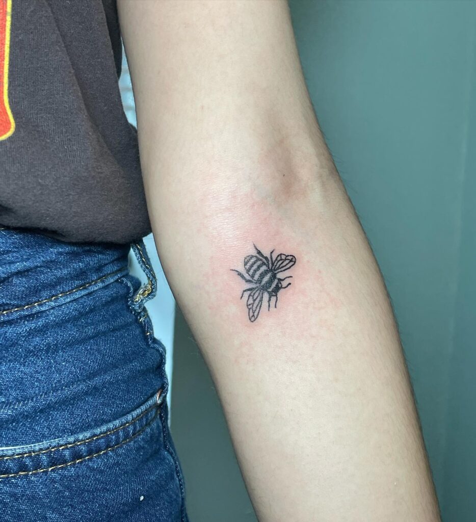 Solid Black Bee Tattoo Below the Elbow: Bold Bee