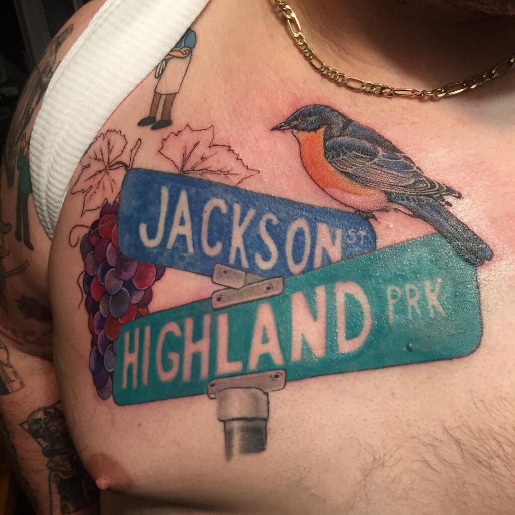 Sparrow Street Sign Tattoos on biceps