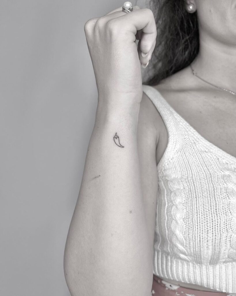 spice up your style small fineline hot peppers tattoo on outer wrist