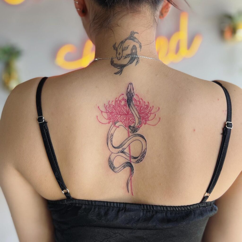 Spider lily with snake tattoo design for women on back