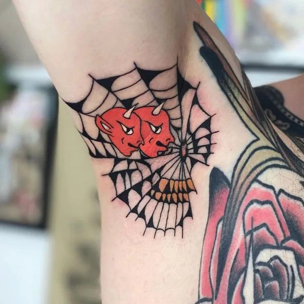 Spider web armpit tattoo