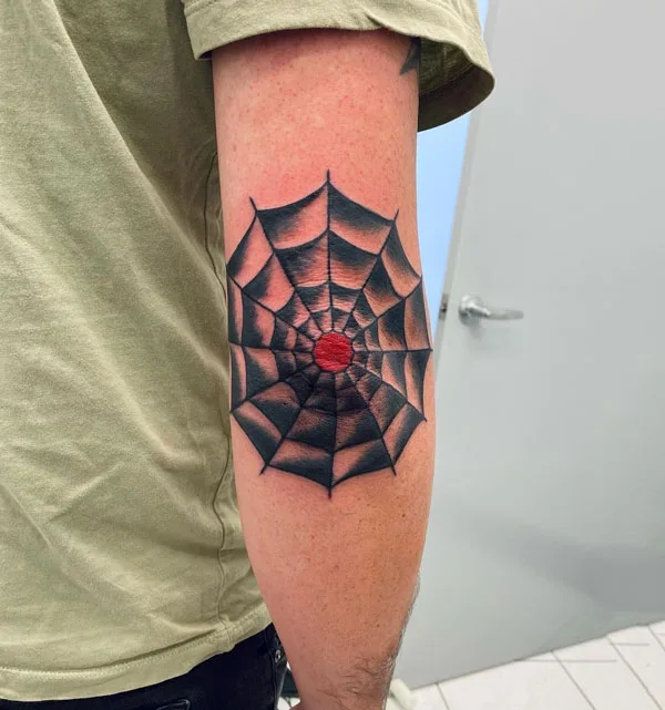 Spider web elbow tattoo