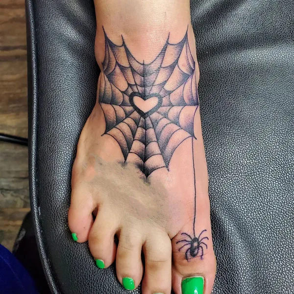 Spider web foot tattoo