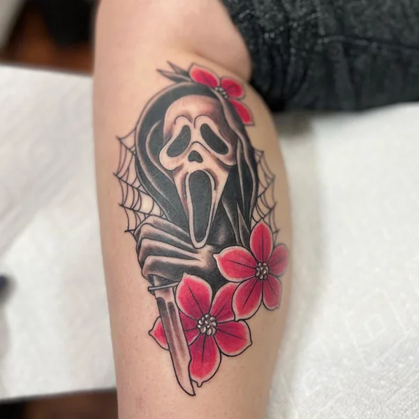 Spider web ghostface tattoo