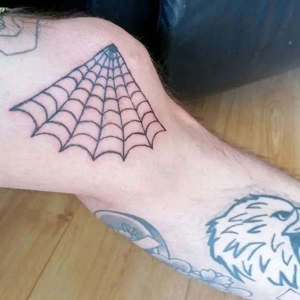 Spider web leg tattoo