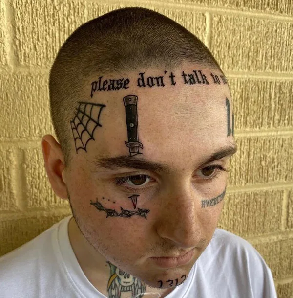 Spider web prison tattoo