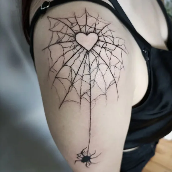 Spider web shoulder tattoo