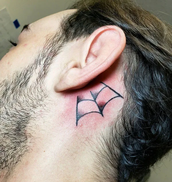 Spider web tattoo behind ear