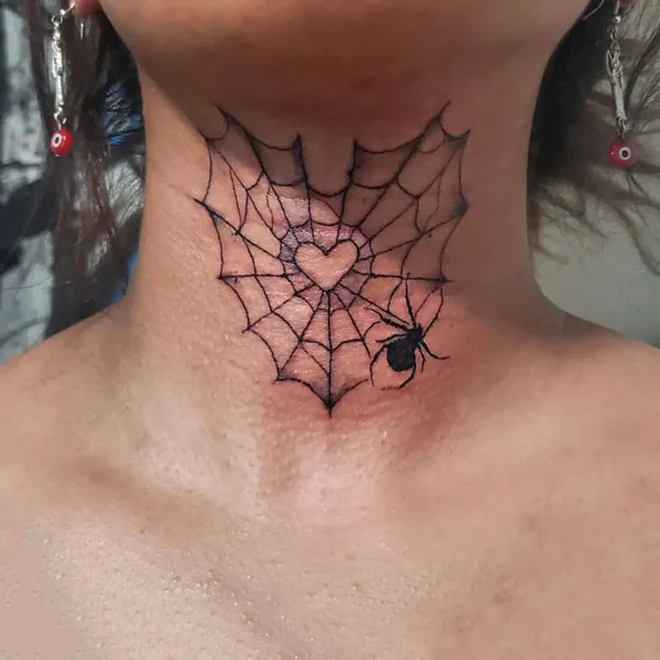 Spider web throat tattoo