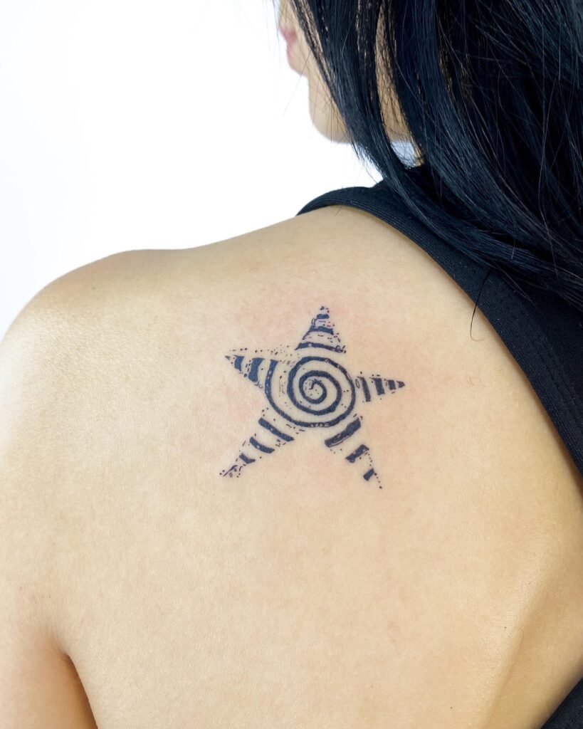 Spiral star tattoo inspiration behind the shoulder