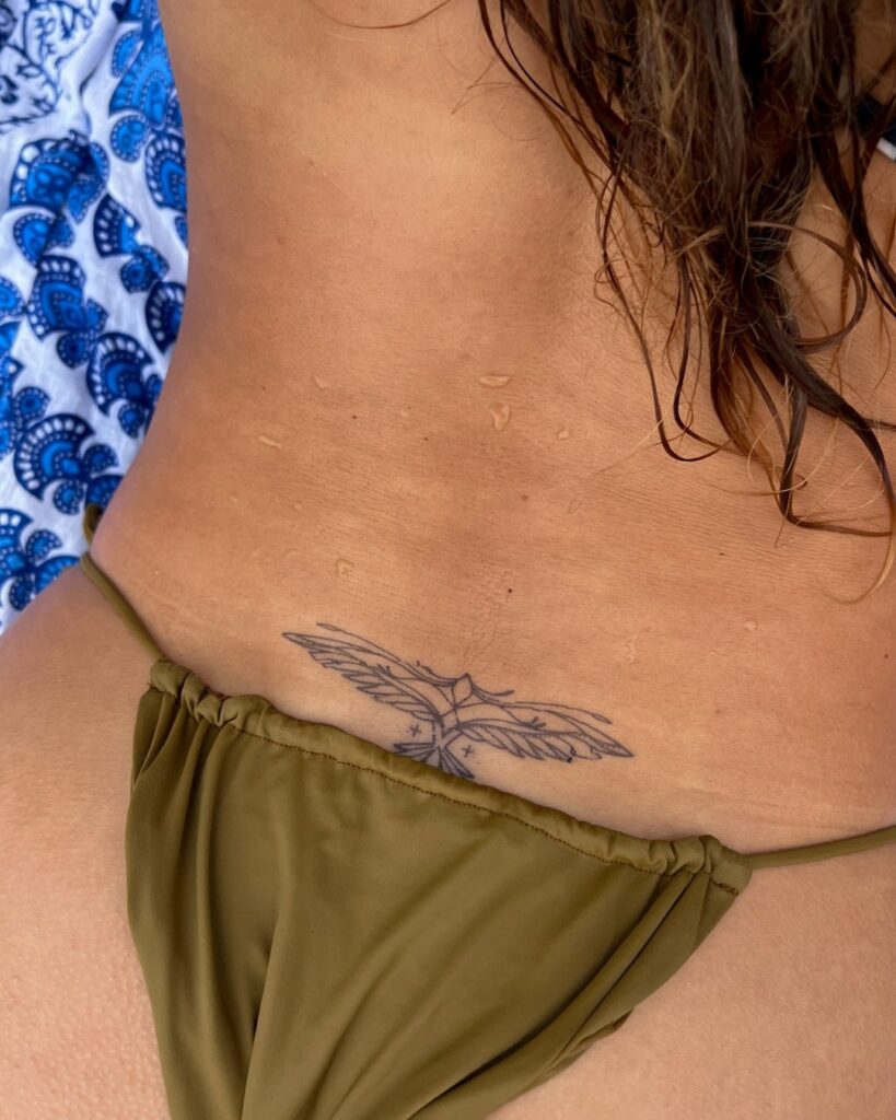 Spread Wings Tattoo on the Lower Back: Phoenix Rebirth
