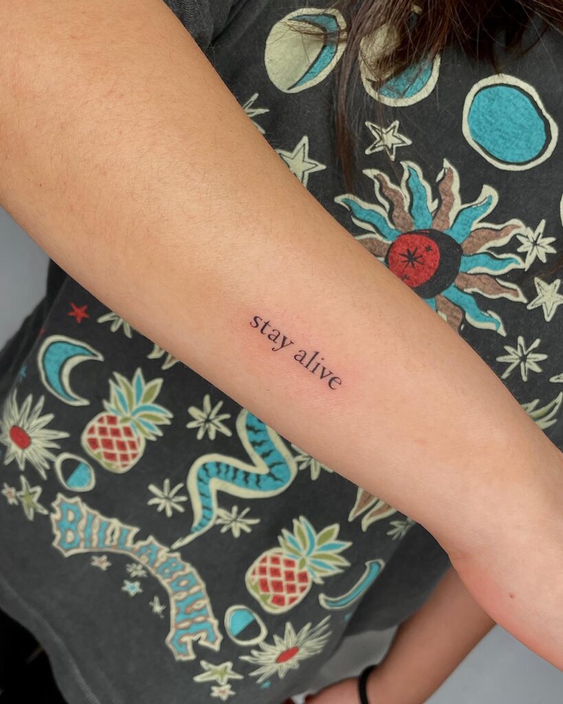 'Stay Alive' Outer Forearm Tattoo for Girls: Empowering Reminder