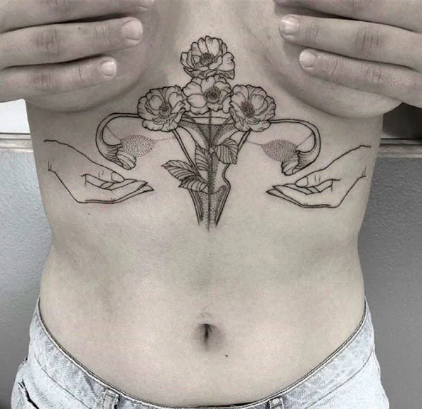 Sternum womb tattoo